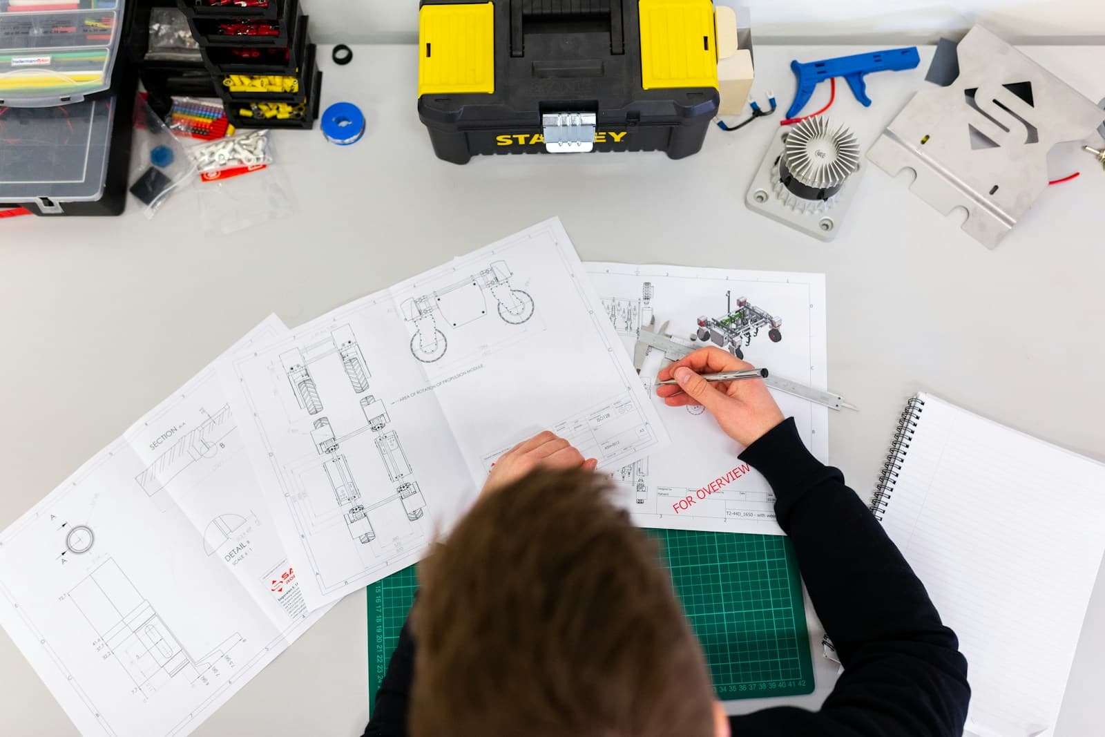 Architecture blueprint and technical diagrams on a desk during planning