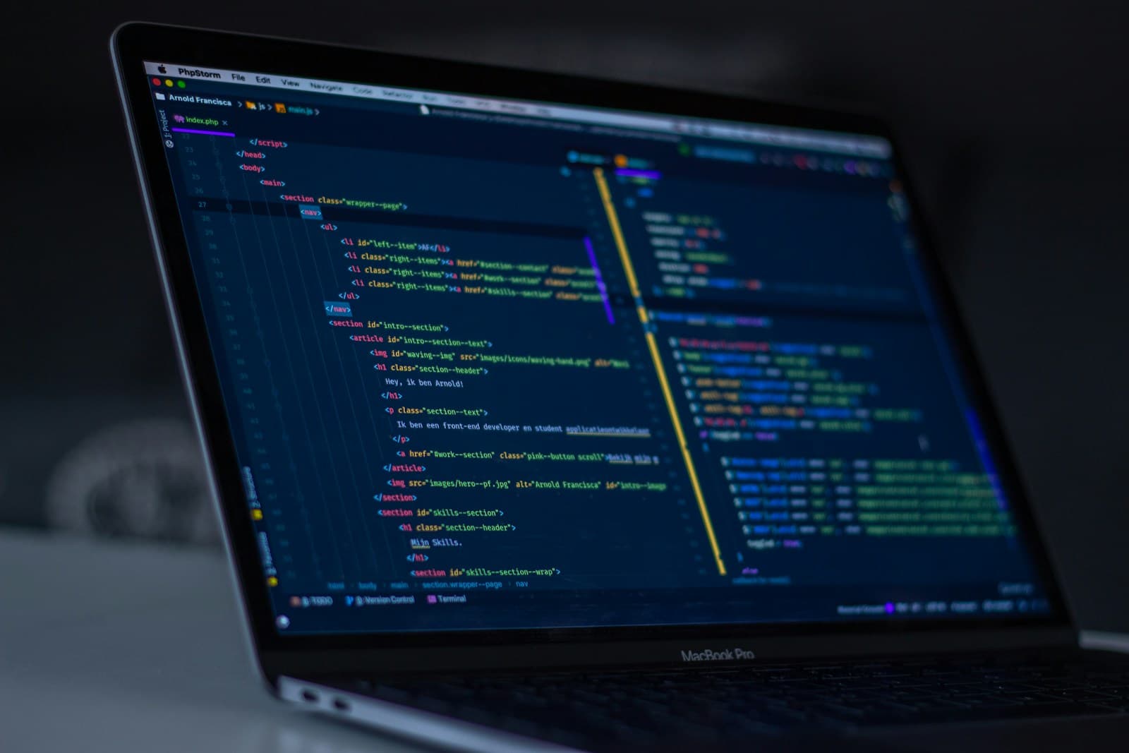 Developers building custom software on multiple monitors in a focused session